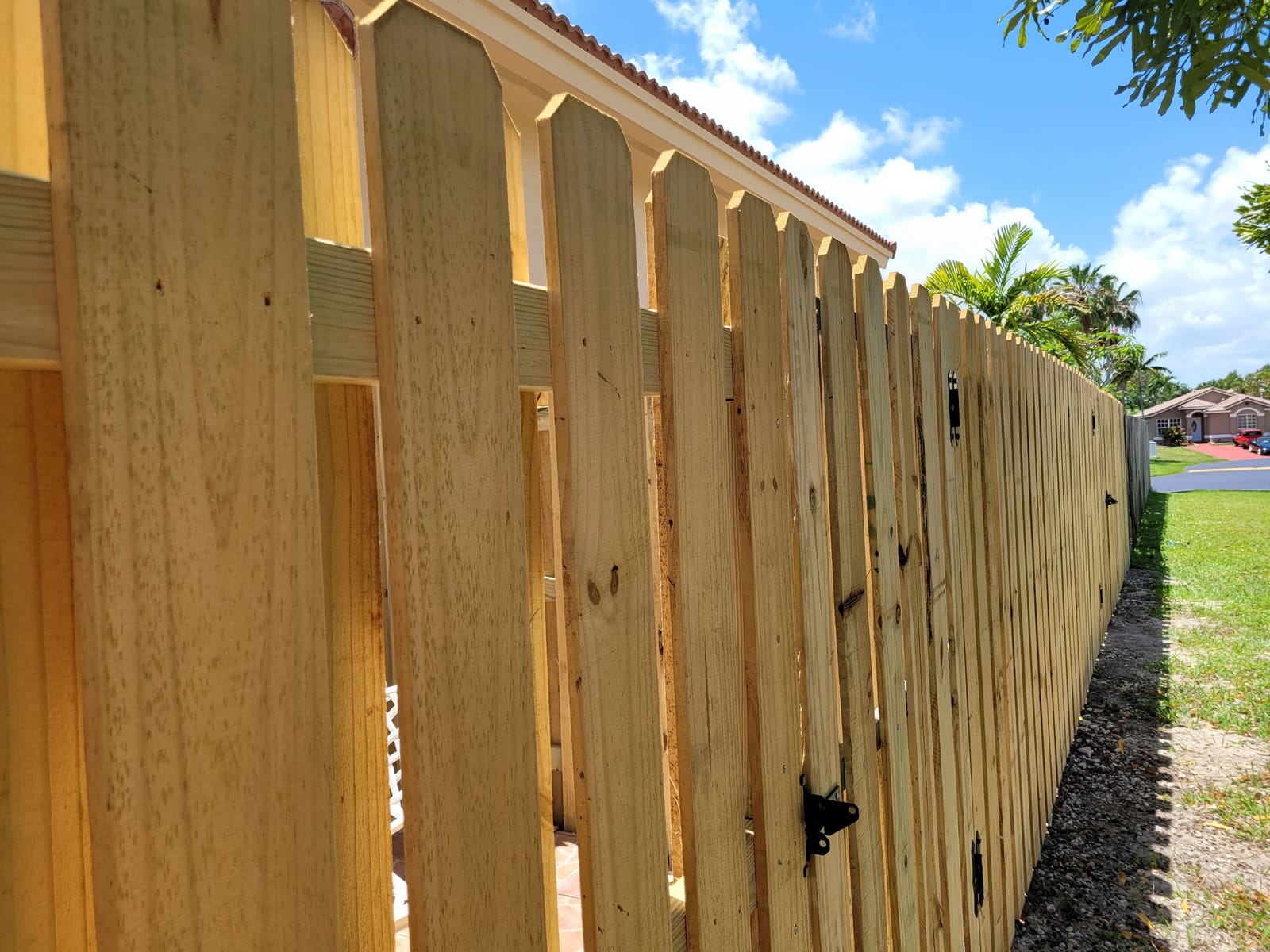 Restored wood fence on a Coral Gables property